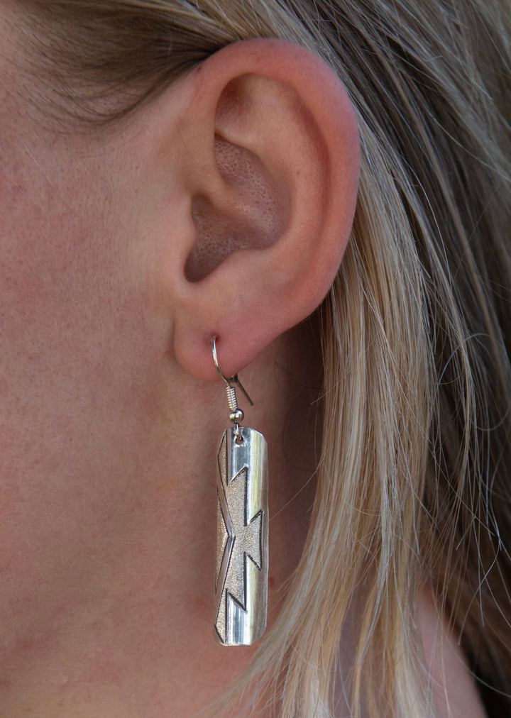 Boots and Silver Earrings